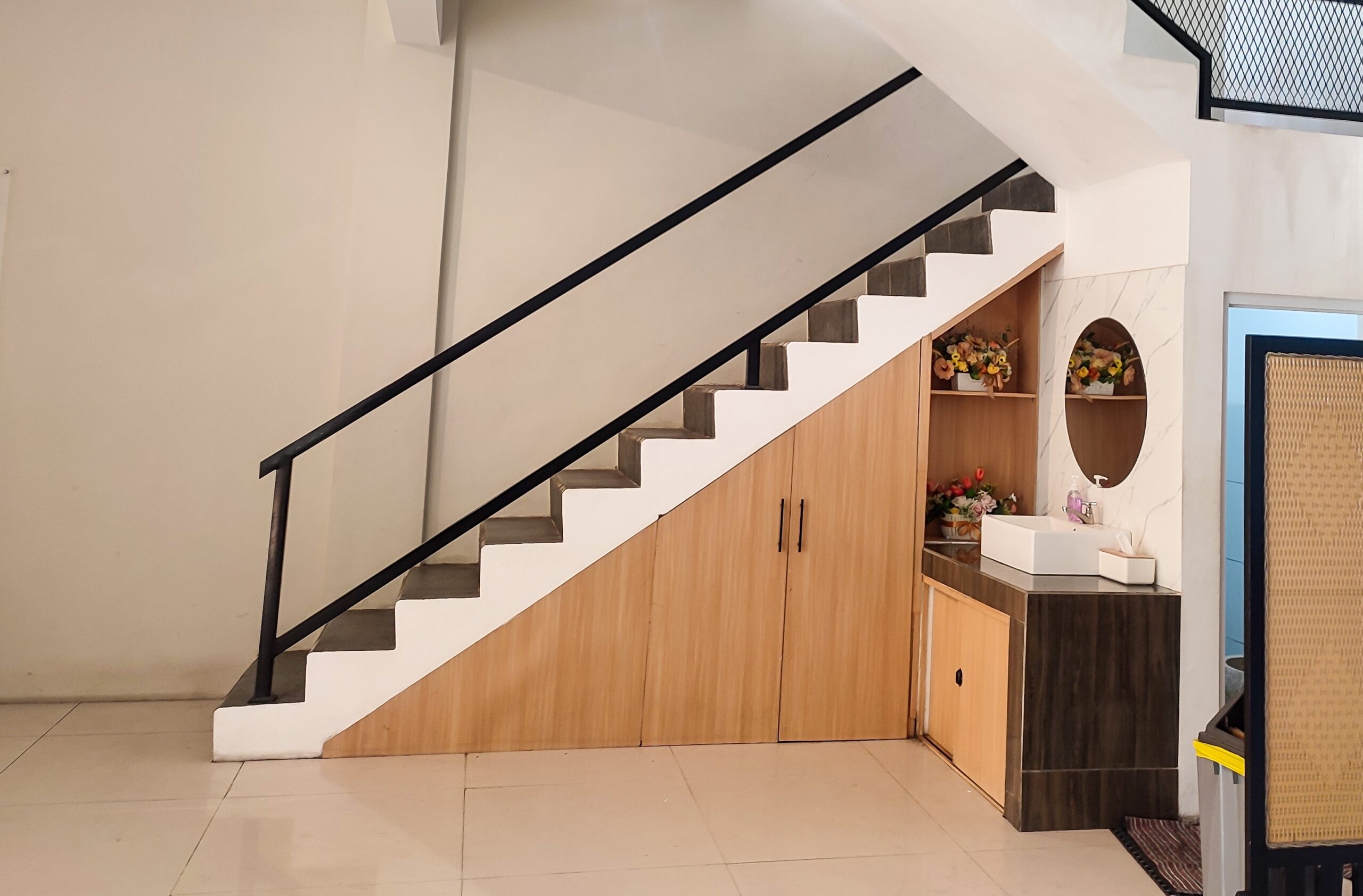 image of drawers under stairs