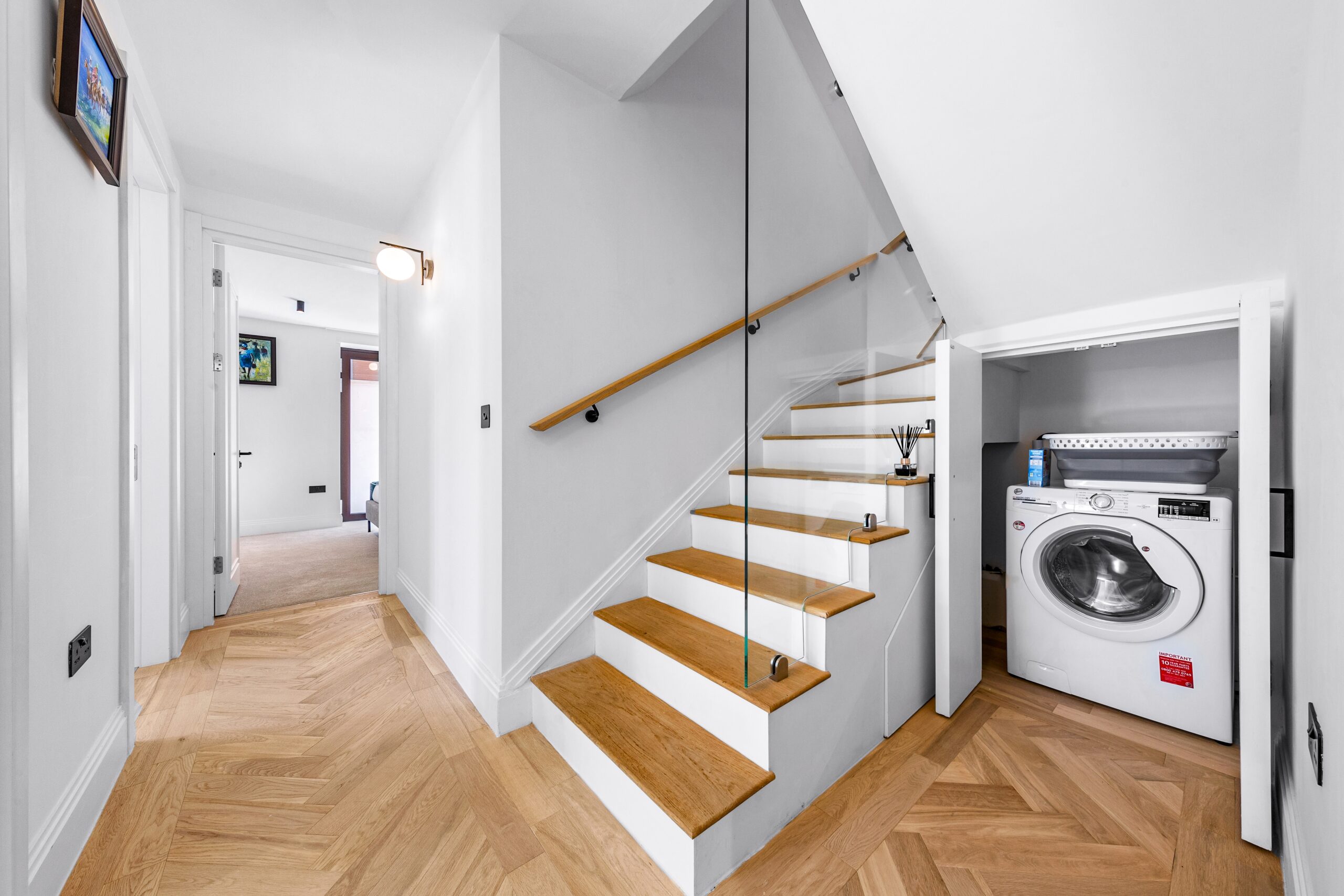 laundry area under stairs