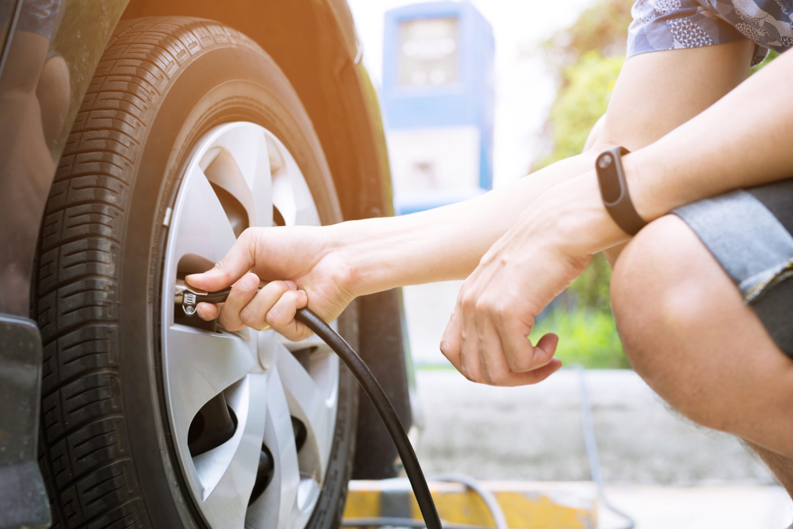 Close up of a person filling their tires