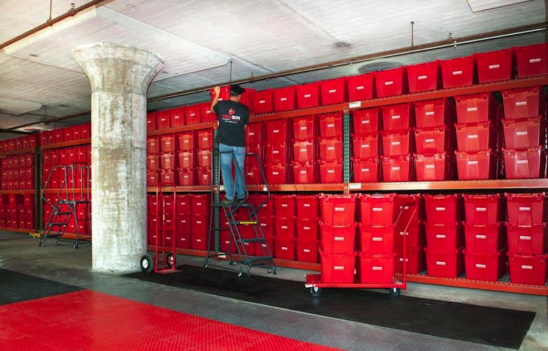 Valet storage containers fill a warehouse wall operated by Brooklyn-based Red Bin. 