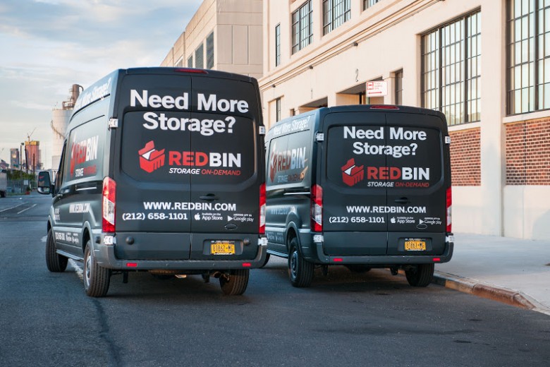 RedBin trucks ready to pick and deliver small storage bins for consumers.