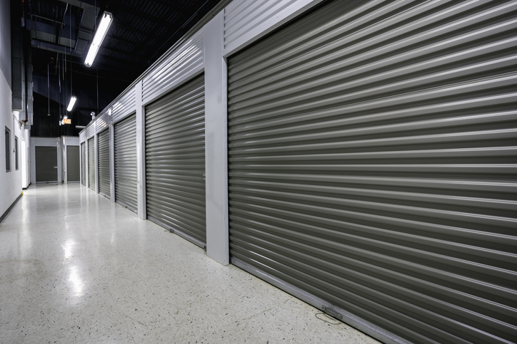 Indoor storage units with grey rollup doors